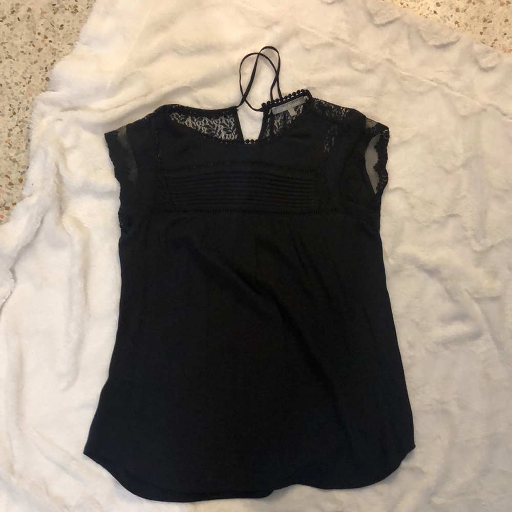 Black flowy top. Has key hole tie in back. NWOT.